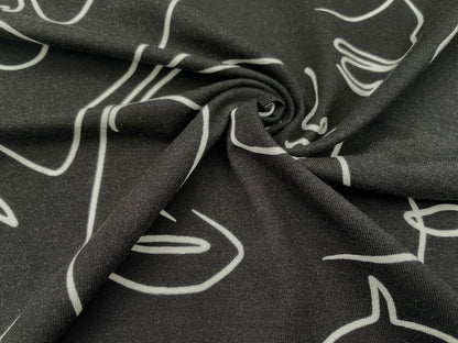 Tencel Jersey "Faces" Schwarz Reststück 120cm x 150cm