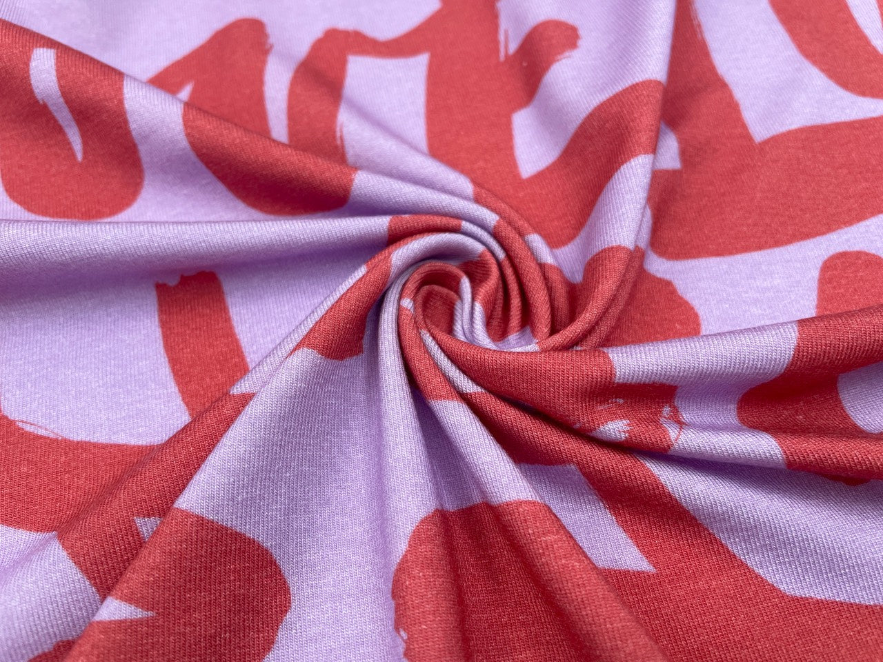 Tencel Jersey "Love" Flieder / Koralle