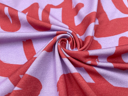 Tencel Jersey "Love" Flieder / Koralle
